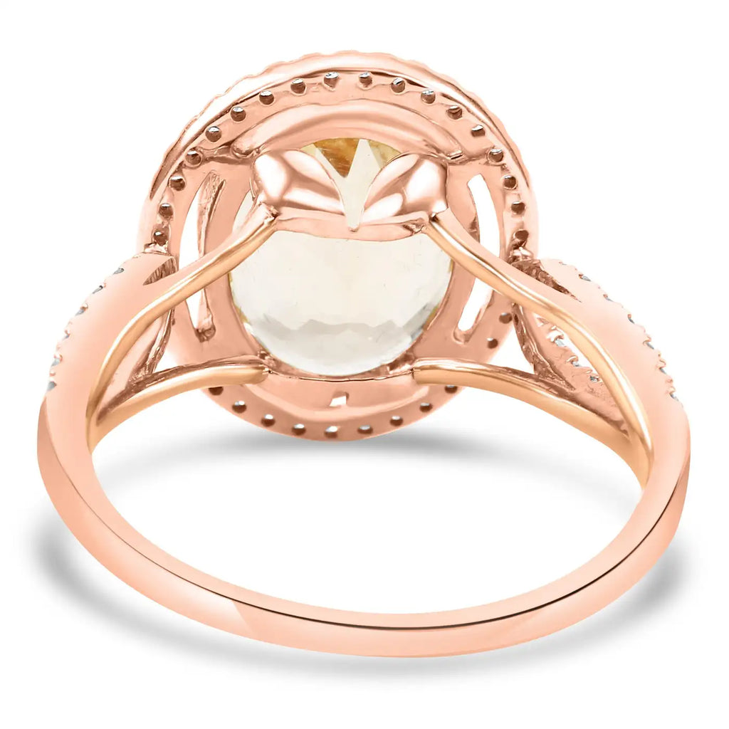 Anillo de compromiso de oro de 14 quilates con halo de morganita ovalada y diamantes redondos blancos